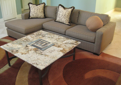 MC2 Design - Custom Design: Custom coffee table with raised rectangular spiral inlaid into granite and a welded base