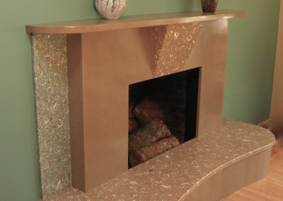 MC2 Design - Custom Design: Custom designed cast concrete fireplace with embedded shell and abalone detailing
