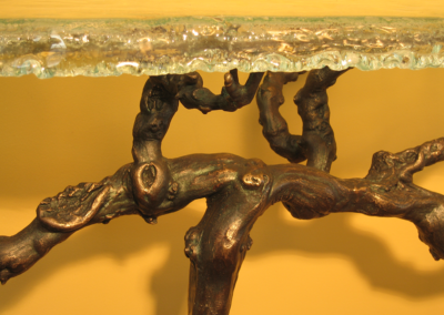 MC2 Design - Design Details: Close-up of cast bronze vine with kiln formed glass top